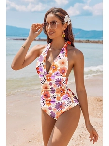 Floral print one-piece swimsuit with halter neck, deep V-neck and ruched tummy control design