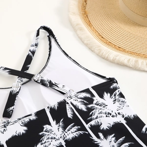 Close-up of coconut print bikini with adjustable straps and silver metal buckles