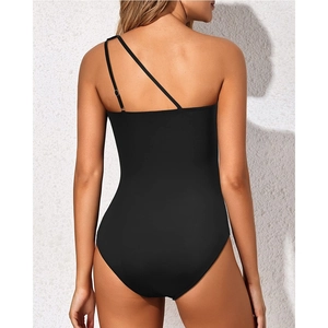 Detail of black one-shoulder one-piece swimsuit featuring unique asymmetrical back straps