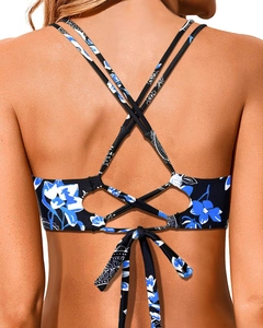 Detail of cross-back straps and adjustable bow on blue paisley print bikini top