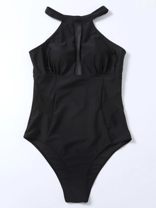 Detail of black one-piece swimsuit featuring mesh paneling and a halter neck design