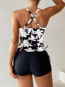 Women's conservative two-piece bikini with palm tree print top and black boy-shorts