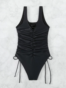 Black one-piece swimsuit with vertical ruffles and adjustable side drawstrings