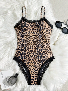 Close-up of leopard print bodysuit with black lace trim and delicate spaghetti straps