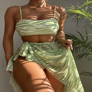 Detail of green zebra print three-piece bikini set with sheer wrap skirt for women