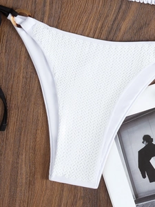 Sexy white sequin bikini bottom with tortoise shell rings and black adjustable side ties