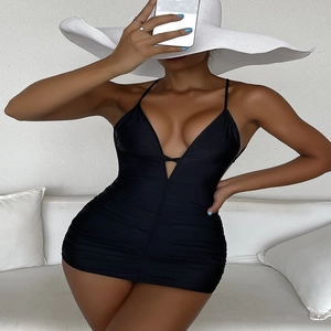 Detail of black V-neck swimsuit featuring elegant side ruching and slimming waist design