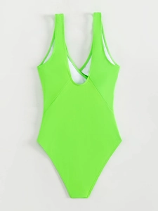Detail view of fluorescent green one-piece swimsuit with V-neck and white lining