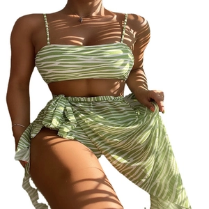 Three-piece green and white zebra print bikini set with mesh cover-up skirt