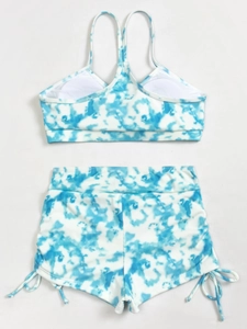 Blue and white tie-dye ribbed two-piece high waisted swimsuit with drawstring details