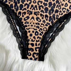Slim fit leopard print bodysuit for women with delicate black lace trim and camel tones