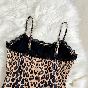 Slim fit leopard print bodysuit for women featuring black lace trim and spaghetti straps
