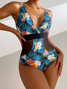 Detail of tropical floral print swimsuit with breathable side mesh panels and V-neckline
