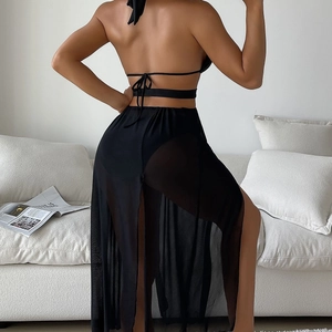 Chic black backless bikini set with a sheer mesh maxi beach skirt for vacation wear