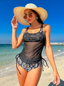 Three-piece bikini set with black sheer mesh cover-up and paisley print swimwear