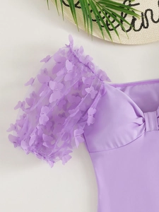 Detail of light purple mesh puff sleeves with 3D butterfly appliques and bow chest tie