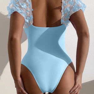 Detail of light blue one-piece swimsuit with 3D butterfly tulle sleeves and open back