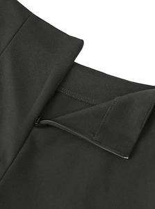 Detailed macro view of the invisible zipper design and stitching on black high waist shorts