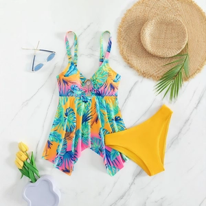 Floral print tankini set with tropical leaves and high cut yellow bikini bottom