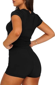 Close-up of ribbed knit fabric texture on the black short sleeve T-shirt and shorts set