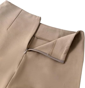 Detailed close-up of high waist khaki shorts featuring an invisible side zipper and seams