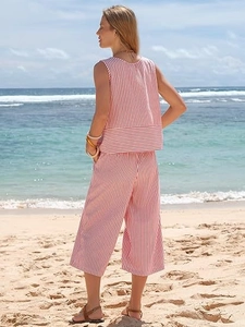 Close-up of red and white striped sleeveless top and wide-leg crop pants for beach vacation