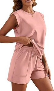 Detail view of pink sleeveless top and high-waist shorts with side pockets