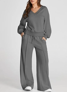 Detailed view of high-waisted drawstring trousers with central seam for a relaxed fit