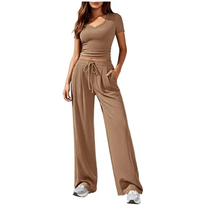 Brown rib-knit two-piece set featuring V-neck crop top and high-waisted wide-leg trousers