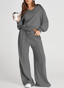 Detail of grey V-neck sweatshirt and drawstring wide-leg pants loungewear set