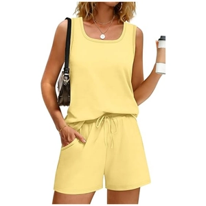 Close-up of light yellow two-piece set featuring sleeveless tank top and drawstring shorts