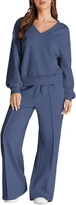 Detail of V-neck sweatshirt and wide-leg trousers with center seam in fog blue