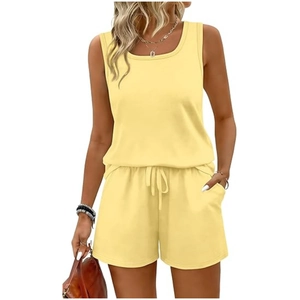 Detail view of light yellow two-piece lounge set showing drawstring shorts with side pockets