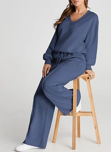 Detail view of navy blue two-piece lounge set with V-neck top and drawstring wide-leg pants