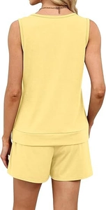 Detail view of the soft ribbed hem on back of the pale yellow sleeveless leisure top