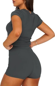 Detail view of dark grey ribbed knit two-piece set showing slim fit crop top and high waist shorts