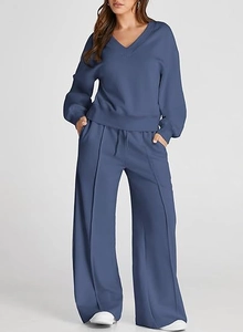 Detail view of the Morandi blue knitted lounge set with V-neck top and wide-leg pants