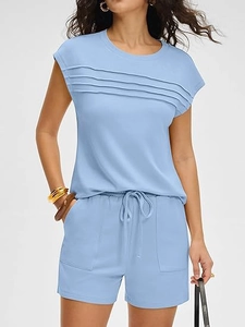 Detail view of light blue two-piece set featuring pleated short sleeves and large pockets