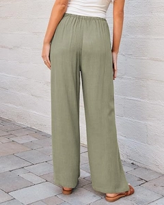 Rear view of high-waisted sage green wide-leg trousers with elastic waistband