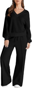 Detailed macro view of black V-neck lounge set showing knitted fabric texture and drawstrings