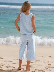 Rear view of a blue and white striped summer two-piece set with crop top and wide-leg pants