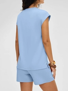 Detail of light blue casual two-piece set featuring side slit hem and elastic high waist shorts