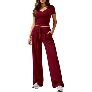 Detail of burgundy V-neck short top and matching high-waist drawstring wide-leg pants
