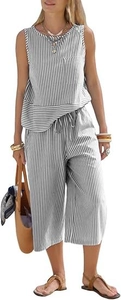 Detail view of the drawstring elastic waist on vertical striped wide-leg trousers