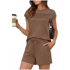 Macro detail of dark brown pleated knit fabric and drawstring waistband on casual shorts