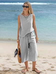 Detail of white and black striped sleeveless top and wide-leg pants set with drawstring waist