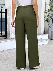 Rear view of high waisted olive green wide leg trousers with elastic waist and texture