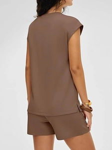 Detail view of dark brown casual summer set featuring side slits and premium drape fabric
