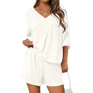 Detail shot of white waffle knit fabric on V-neck short sleeve top and shorts set