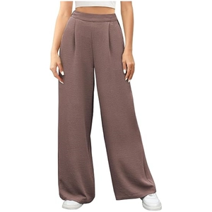 Detail shot of dusty mauve high-waisted wide leg trousers with textured vertical fabric